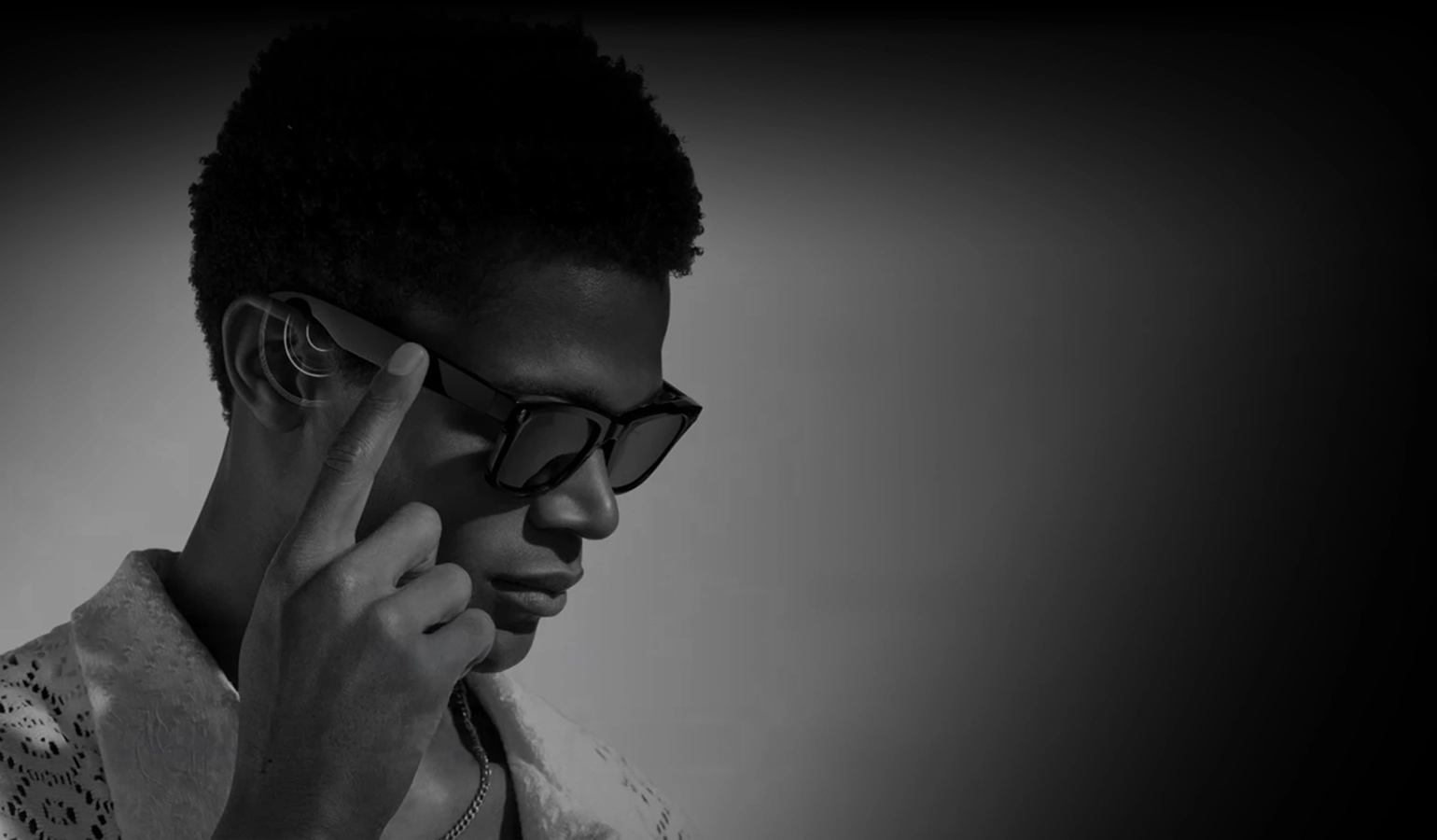 Man listening to Zeblaze AI Shooting Glasses