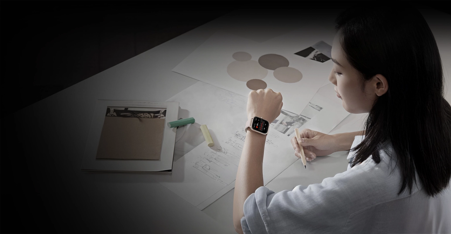 A woman uses the Zeblaze GTS 4 smartwatch