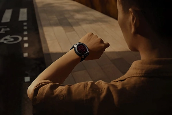 Man looking at his Zeblaze Stratos 3 Pro smartwatch